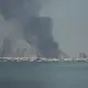 Asap mengepul setelah Iran melancarkan serangan rudal ke markas utama Armada ke-5 Angkatan Laut AS., 28 Februari 2026. Foto/Stringer/Anadolu Agency